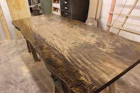The two table halves open and close in the center allowing for up to three 18 wide table leaves. Dark Stained Curly Maple Live Edge Dining Table Top Slab Wunderwoods Wunderwoods