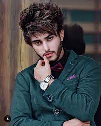 16 years old teenager using smartphone and listening to music in earphones while relaxing on couch in his room Stylish Edit Stylish Attitude Handsome Boy Pic Novocom Top