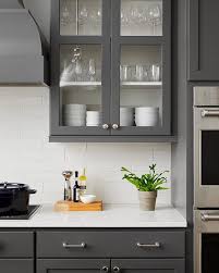 Open concept small but updated kitchen. White Cabinets With Dark Grey Quartz Countertops Novocom Top