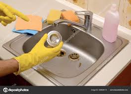 cleaner in rubber gloves shows clean