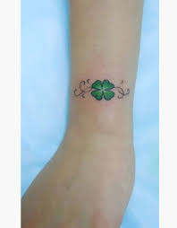 Clover leaf tattoo on foot. 24 Lucky Irish Four Leaf Clover Tattoos Designs Clover Tattoos Shamrock Tattoos Four Leaf Clover Tattoo