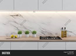 It has linear veining patterns that are either feathery soft or fine, and some marble countertops are a great idea if you want to elevate the look of kitchen or bathroom to elegance. White Marble Kitchen Image Photo Free Trial Bigstock