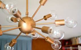A gold or brass fixture provides a contemporary take on midcentury design, while a finish like pewter can elevate a timeless, classic design without feeling too showy. Midcentury Lighting A Sputnik Chandelier Simple Practical Beautiful