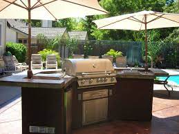 Have your family and friends over to enjoy the great outdoors. Bbq Island With Umbrellas Outdoor Kitchen Design Outdoor Kitchen Design Layout Outdoor Kitchen
