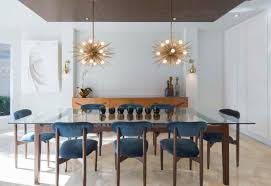 White dining room offers a sleek floating table across the gray dining table with modern chairs illuminated by a cylindrical pendant light. 10 Tips In Choosing The Perfect Dining Table Light Home Design Lover