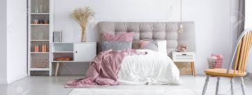 Soft, romantic, and soothing, pink and gray bedrooms make for some seriously dreamy spaces to, well, dream. Modern Trendy Furniture In A Cozy Minimalist Bedroom With Copper Accessories And Pastel Pink Accents Stock Photo Picture And Royalty Free Image Image 86989021