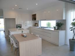 Contemporary Coastal Kitchen Essastone Benchtops Polar White Silk Finish Cabinet Kitchen Design Contemporary White Contemporary Kitchen Design Kitchen Design