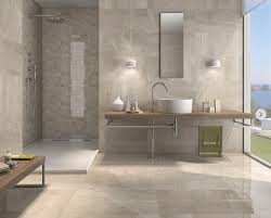The rough brick wall and unfinished wood table of this space contrast with the smooth, geometrical look of the washbasin and mirror. Gray And Beige Bathroom Design Ideas 16 Photos Hackrea