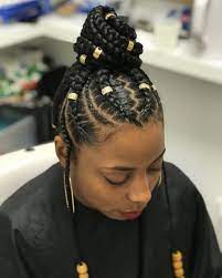 Compact Braided Bun Updo With Side Twists Goddess Braid Bun Braid Bun Updo Goddess Braids