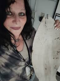 Appreciative coworkers buy painted fish back from artist