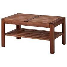 A rattan table that features a glass layer at the top. Outdoor Coffee Tables Patio Side Tables Ikea
