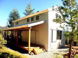 When it was found, this ranch house was sagging off a loose stone foundation. Cosy Metal Building Cabin W Wrap Around Porch Hq Plans Pictures Metal Building Homes