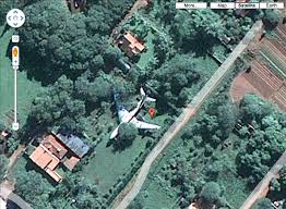 Johnny stands on the edge of the boat in a wetsuit, snorkeling gear and flippers. More Mystery Airplanes On Google Maps In A Yard Under The Sea