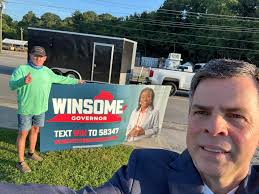 Waving good morning to folks with a Winsome Earle-Sears sign in Danville,  Virginia