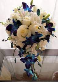 See more ideas about orchid bouquet, blue orchid bouquet, wedding bouquets. Cascade Of White Roses Alstroemeria Lisianthus And Blue Dendrobium Orchids Beach Wedding Flowers White Wedding Bouquets Dendrobium Orchids Wedding