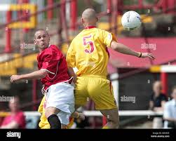 FC United of Manchesters Jonathan Mitten (L) battles with Leigh RMIs Liam  Coyne for the ball. FC United of Manchester was formed by Manchester United  supporters following Malcolm Glazers takeover of the
