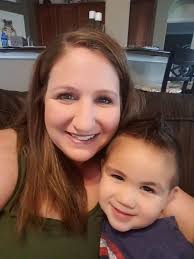 Dad getting into onesie to entertain his girls