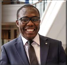 PERI faculty members (from left) Steven Sprick Schuster and Daniel Smith  celebrate PERI Fellow Gabriel Benzecry's successful def