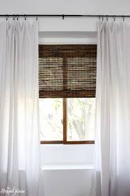 Window Makeover With Bamboo Blinds White Curtains And Classic Black Curtain Rod Traditionaldecor Living Room Windows Curtains With Blinds Living Room Blinds