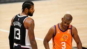 Paul george #13 of the la clippers controls the ball ahead of devin booker #1 of the phoenix suns during the third quarter in game two of the nba western conference finals at phoenix suns arena on june 22, 2021 in phoenix, arizona. Gnx5cbblby6d6m