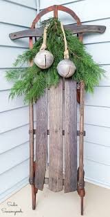 For flowers or other ornaments. Wooden Sled Decor With Sweater Mittens For Front Porch Christmas Decor