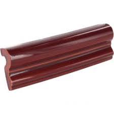 It's a true white ceramic wall tile in a traditional design and a new, modern color. Mexican Tile Merlot Gloss Chair Rail Molding Malibu Ceramic Tile
