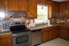 Unfinished pine kitchen cabinets in grouping with the wooden boards in the kitchen complement it with a a white lighting falling over the island brightens evening meal preparation. Best Pine Kitchen Cabinets Original Rustic Style Beautikitchens Com