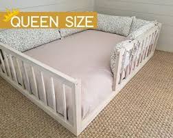 hardwood montessori floor bed with 4 railings made in ohio usa in 2021 toddler floor bed floor bed montessori floor bed