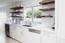 Put a shelf above your kitchen window! White Kitchen With Wood Floating Shelves Contemporary Kitchen