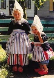 Aside from the wooden shoes, traditional dutch costume includes a variety of dresses, pants and shirts, hats and other. Girls In Traditional Dutch Clothing Kids Around The World Dutch Girl Holland