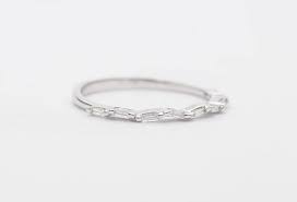 The thin half eternity band will make you admire the glittering of the diamonds. Tapered Baguette Diamond Ring 14k Gold Thin Wedding Band Dainty Asymme Aurora Designer