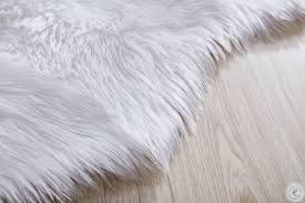 Cleaning a white fur rug is easiest by doing a bit of preventive maintenance from time to time. Luxury Decorative White Sheepskin Small Faux Fur Rug From Amazing Rugs Coleman Furniture