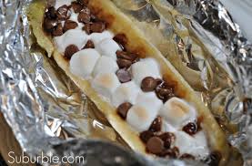 If you don't have a fire pit, we suggest you get one — and then get cooking! Chocolate Marshmallow Banana Boats Campfire Food Camping Desserts Campfire Desserts