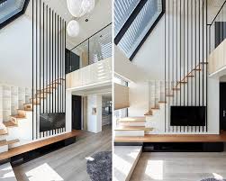 If the ceiling is too high, while the room may look good, it may feel uncomfortable and people don't know why. Long Metal Poles Draw Attention To The High Ceiling Of This Apartment