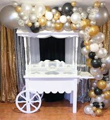 Candy Cart Backdrop And Balloon Garland Set Up Black And Gold Balloons Balloon Garland Gold Candy