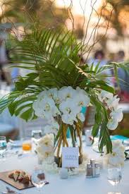Alpha Omega Orchids Palms And Twigs Centerpiece Tablescapes Tropical Wedding Centerpieces Wedding Centerpieces Tropical Wedding