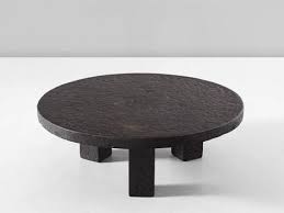 This sculptural coffee table pairs an airy, open base with a stone surface, creating an unexpected, inverted silhouette. Round Stone Iron Look Cocktail Table Stone Coffee Table Coffee Table Cool Coffee Tables