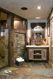 Rustic primary bathroom featuring a stunning fireplace design and two sink counters, along with a classy area rug covering the tiles flooring. 17 Comely Bathroom Decor Ideas Themes Rustic In 2021 Rustic Bathroom Remodel Rustic Bathroom Designs Rustic Bathroom Decor