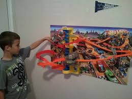 I used to spend hours with my brother and cousins as we set up tracks and raced cars all day long. Toyxplosion Com Hot Wheels Wall Tracks Hot Wheels Wall Hot Wheels Bedroom