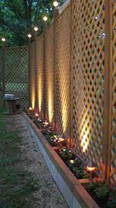 Seven Ways To Brighten Up Your Landscape With Outdoor Lights Privacy Fence Designs Backyard Renovations Backyard Fences