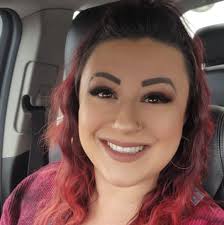 Unfortunately, my sister got cut out of this family photo at the Popcorn  Fest. But fortunately, a woman we didn't initially notice took her place  with this cute photo-bomb behind us. If