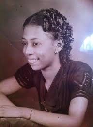 This is my great aunt Beulah Akers Alexander, she was a switchboard  operator in Caledonia, Missouri I believe. She is holding her baby.