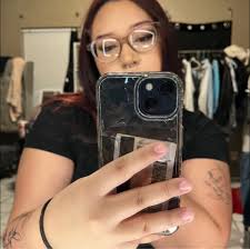 Is there any good female tattoo artists around the area?? :)) that won't  charge too much!