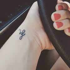 Finger tattoo ideas 30 tattoo designs for men and women. Child S Initials Simple And Dainty Tattoo Tattoos For Kids Dainty Tattoos Kids Initial Tattoos