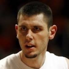 Illinois' Mike Tisdale held without a field goal because of foul trouble,  Spartans' defense