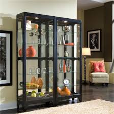 We have dining room cabinets with glass doors in different sizes and styles. Pulaski Furniture Curios 21218 Curio Cabinet With Dark Finish Baer S Furniture Curio Cabinets