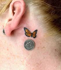 Butterfly tattoo behind ear red ink. Peekaboo 25 Behind The Ear Tattoos That Are Hidden Gems