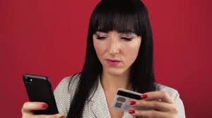 Cashback debit is the online checking account with a debit card that lets you earn cash back for cash back isn't just for credit cards. Young Woman Holding A Smartphone In Her Hands And Making Online Purchases Through A Debit Card Over Red Background Video By C Ann Kolesnuk Ukr Net Stock Footage 432784236