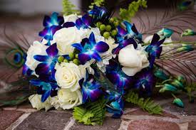 Maybe you would like to learn more about one of these? White Rose And Dyed Blue Orchid Bouquet