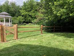 It involves skills which early settlers used when fencing their land, and it is an easy fence to build. 2 Rail Split Rail Fence With Weld Wire Mesh Installed In Northampton Mike Steve From Triborofence Woodfence Split Split Rail Fence Fence Styles Rail Fence